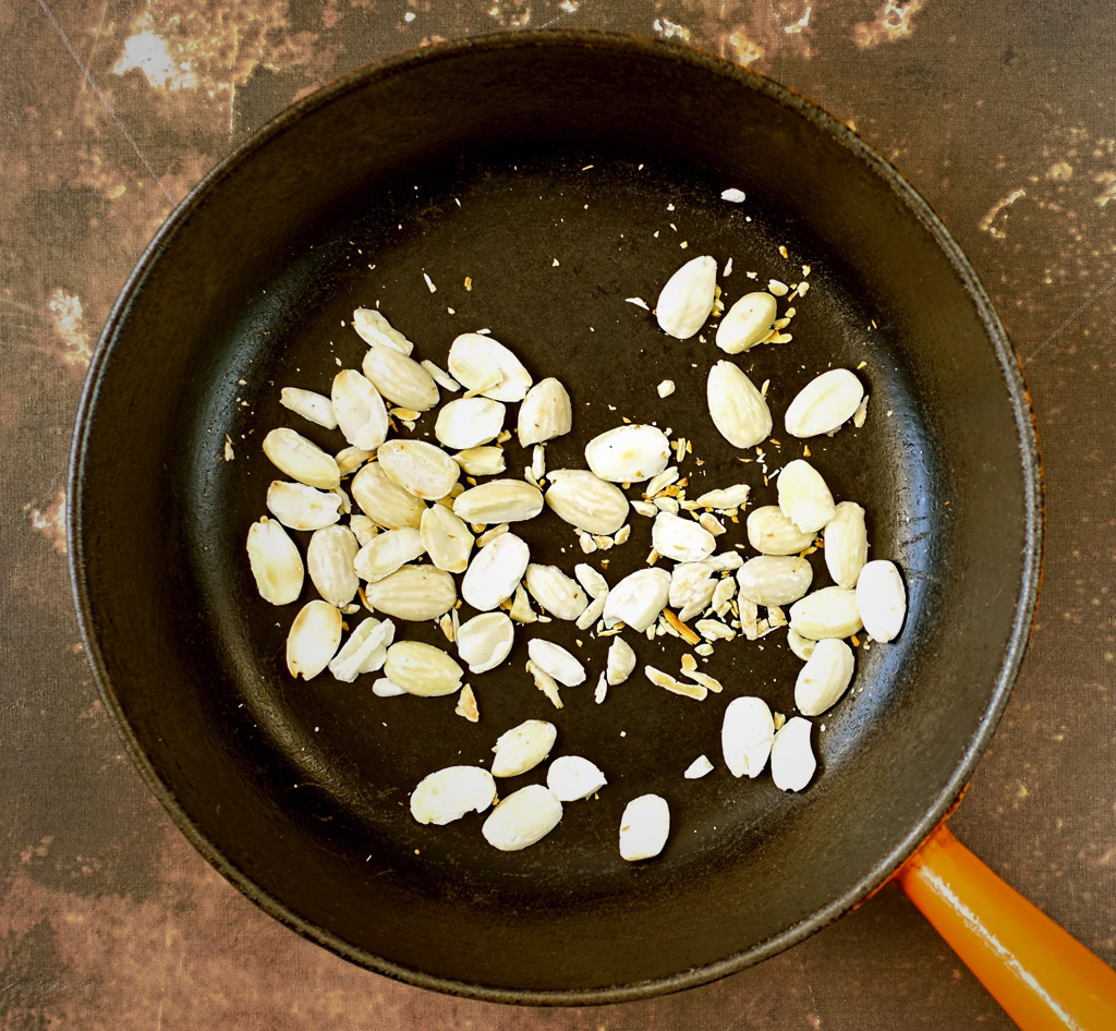 Toasting almonds in a pan